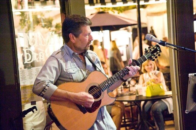 Mark Ginsberg playing guitar